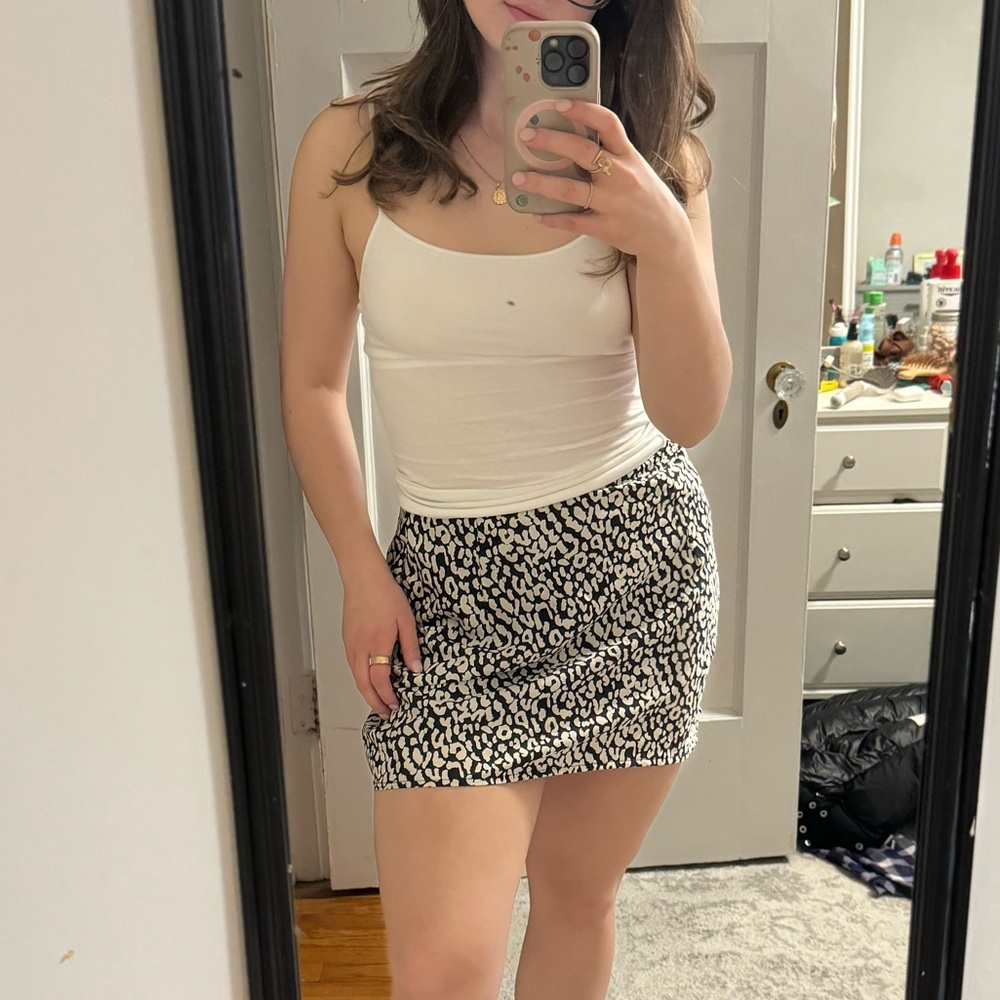 White Tank Top and Black Patterned Skirt